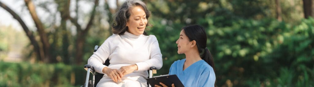 Student on work placement smiling with an older person in an aged care setting