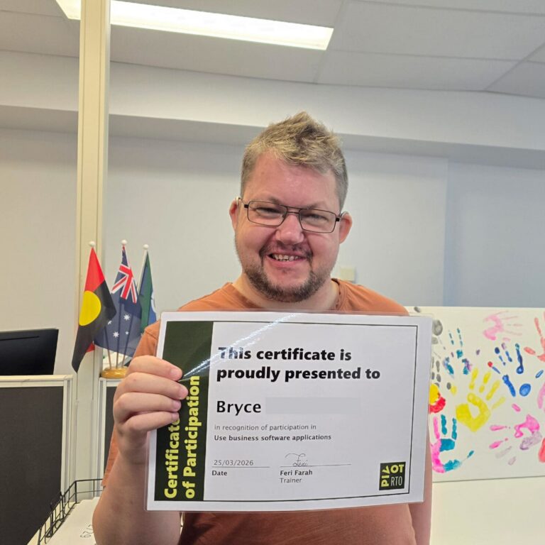Person holding a certificate in a training workspace, representing a digital literacy skills framework that supports practical digital skills.